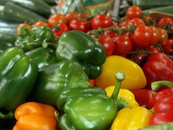 Yellow, green and orange peppers and cherry tomatoes